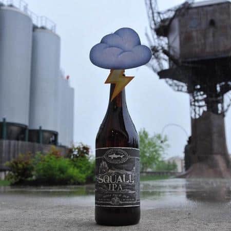 Squall IPA beer bottle with a cloud and lightning on top of the cap.