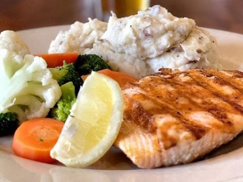 Salmon entree menu item at Dogfish Head Alehouse Restaurant